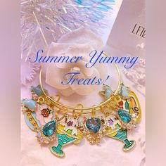 Summer Sweets Gold Charm Bangle Bracelet With : Center Aqua Crystal Teardrop With Gold Trim 2 Ice Cream Sundae In Aqua Colored Dish 2 Aqua Crystal Teardrops With Rhinestone Trim Strawberry Parfait With Yummy Strawberry On Top Fruity Pancakes With White Frosting 2 Aqua Bows With White Polka Dots And Center Rhinestone Free Earrings With Purchase ! Sweet White Bracelet Jewelry, Cute Bangle Jewelry For Birthday, Cute Bangle For Birthday, Cute Birthday Bangle Jewelry, Sweet Adjustable Charm Bracelet For Gift, Adjustable Sweet Jewelry For Party, Sweet Adjustable Charm Bracelet As Gift, Sweet Dangle Jewelry, Strawberry Parfait