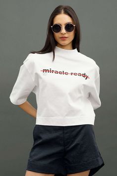 White Heavy Weight Mock Tee Modern Crew Neck T-shirt With Branding, Relaxed Fit Cropped T-shirt With Logo Print, Sporty Summer Tops With Branding, Modern Short Sleeve T-shirt With Letter Print, Cotton Athleisure T-shirt With Branding, Everyday Athleisure T-shirt With Graphic Print, Modern Relaxed Fit T-shirt With Text Print, Athleisure T-shirt With Letter Print, Athleisure Cotton Tops With Text Print