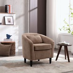 a living room scene with focus on the chair and coffee table in the foreground