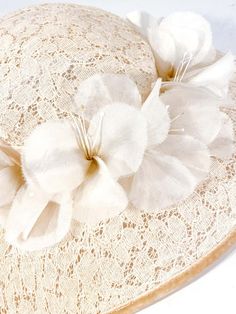 For Sale on 1stDibs - 1950s cream-colored starched lace picture hat with handmade french silk flowers, velvet trim, and bow accent. This hat is meant to be worn with a hat pin Cream Mini Hats For Vintage Events, Cream Cloche Mini Hat For Garden Party, Cream Hat For Church, Vintage Cream Mini Hat For Formal Events, Cream Hat Headpiece For Church, Vintage Cream Mini Hat For Formal Occasions, Vintage Beige Hats For Wedding, Vintage Beige Mini Hat For Wedding, Vintage Beige Hats For Weddings