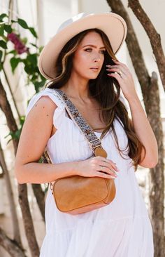 Fall in love with the Amelia, a classic crossbody that went viral on TikTok—and for good reason! It's that's complete with special details that make this beauty extraordinary. You'll swoon over the braided zipper pulls, dreamy desert-inspired color choices, and buttery vegan leather. This boho crossbody has the space and organizational features for all that you'll need on the go, including a back zippered pocket for smaller must-haves and two interior pockets inside the spacious interior. The wo Long Strap Bag For Summer, Chic Summer Bag Strap With Detachable Strap, Bohemian Bag Strap For Everyday Use, Viral On Tiktok, Boho Aesthetic, Boho Bags, Timeless Accessories, Boutique Brands, Modern Chic