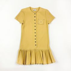 -SO SO GOOD!  -1960s Jonathan Logan pale yellow drop waist mini dress  -major mod vibes  -small pocket with X detail  -no flaws to note  -would best fit a size small, fabric has a little give to it  -heavy weight polyester  -buttons down the front  -black contrast stitching  MEASUREMENTS shoulders: 14.5 inches from seam to seam  armpit to armpit: 18.5 inches flat  waist: 17 inches flat  hips: 19.5 inches flat  length: 35 inches armpit to bottom of sleeve: 1.5 inches Retro Mini Dress With Ruffles, Vintage Ruffled Mini Dress For Fall, Vintage Mini Dress With Ruffle Hem, Yellow Short Sleeve Vintage Mini Dress, Mod Clothing, Jonathan Logan, Mod Scooter, 1970s Fashion, Double Knit