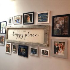 there is a sign that says happy place with many pictures on the wall behind it