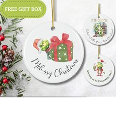 three christmas ornament hanging from a tree with presents on it and the text free gift box