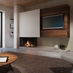 a living room with a fire place and television on the wall