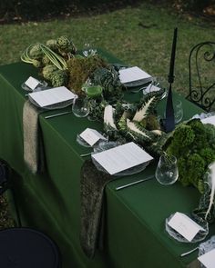 the table is set up with place settings for guests to sit down and read their menus