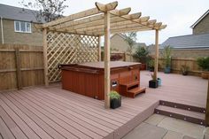 an outdoor hot tub on a wooden deck