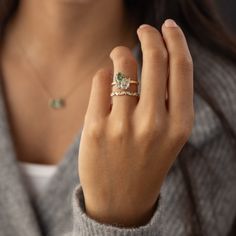 a close up of a person wearing a ring