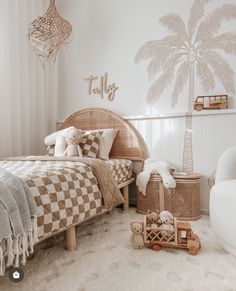 a child's bedroom with palm tree stencils on the wall and checkered bedding