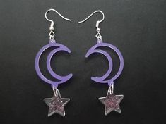 These lightweight purple cresent moon and star earrings are made with resin and glitter to make unique galaxy themed dangle and drop earrings :) Every pair may vary from the original listing as they are all hand made to order. Purple Celestial Dangle Earrings, Celestial Purple Dangle Earrings, Handmade Purple Celestial Earrings, Musical Outfits, Aesthetic Items, Alt Clothing, Moon And Star Earrings, Dark Style, Crescent Moon Earrings