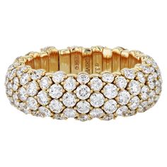 This delightful 18kt gold stretch ring features 3.80cts of sparkling round diamonds, in a tasteful and classic look. The expanding stretching action makes this ring easy and comfortable to slip on and off, while its outstanding manufacturing ensures that the springs are both sturdy and durable.   Diamond Yellow Gold Stretch Ring. 3.80ct TW F-VS Diamonds. 18kt. Yellow Gold. Stretch adds comfort and easy on/off. Stretch Ring, Vs Diamond, Pave Diamonds, Classic Looks, On Off, Fashion Rings, Round Diamonds, Jewelry Rings, Sparkle