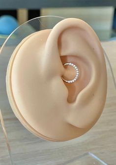 a fake ear with a ring on top of it