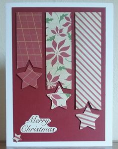 a christmas card with paper stars on it