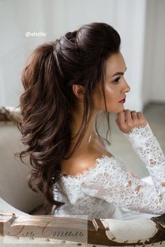 a woman with long hair in a white dress