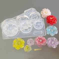 plastic flower molds are shown in various colors