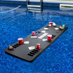 a board game sitting on top of a blue swimming pool