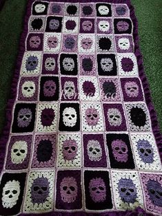 a crocheted blanket with skulls on it