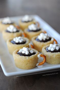 small desserts with marshmallows and chocolate on a white plate