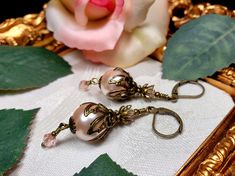 "Pink Pearl Victorian Earrings Gothic Pink Peach Steampunk Light Orange Edwardian Dangle Antique Gold Bronze Titanic Temptations 19012 Matching Necklace: https://www.etsy.com/listing/747057581/peach-pink-pearl-victorian-necklace \"Princess Pearl Drops\" EPiB19012 1 Pair of Vintage Style Filigree Dangle Earrings Handmade, Free Style Design Peach Pink Crystal Pearls Light Pink Faceted Rondelle Crystals Antiqued Bronze Filigree Brass Findings Vintage Style Lever Back Ear Clasps Capture the Romantic Tahitian Black Pearls, Victorian Steampunk, Light Peach, Steampunk Jewelry, Peach Pink, Edwardian Fashion, Pink Pearl, Light Orange, Crystal Pearls