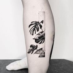 a black and white photo of a plant on the leg