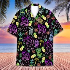 - Premium Fabric: Our Hawaiian shirt for men women men are made from lightweight, soft polyester - breathable and comfortable, which provide our customers with a great put-on experience. The elegant workmanship ensures the hawaiian button down shirt fits your body excellently. - Awesome Bigfoot Tiki Hawaiian Shirt: Add a touch of the tropics to your wardrobe with our new Hawaiian shirt collection featuring tropical summer prints. Whether you're lounging at the beach or attending a backyard barbe Black Printed Hawaiian Shirt For Beach Season, Black Hawaiian Shirt For Beach Season, Black Hawaiian Shirt With Camp Collar For Beach, Black Printed Hawaiian Shirt For Beach, Black Shirt For Beach Season, Black Relaxed Fit Hawaiian Shirt For Beach, Black Camp Collar Shirt For The Beach, Black Tropical Hawaiian Shirt For Beach, Boys Hawaiian Shirt