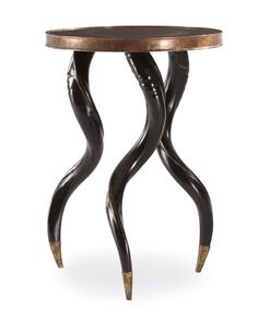 an artistically designed side table with curved legs and a wooden top, on a white background