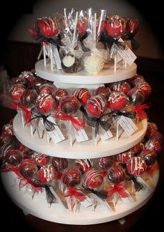 three tiered cake stand with candy and lollipops