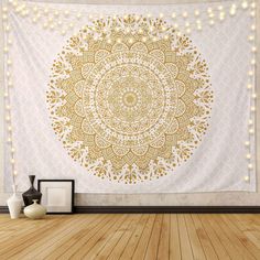 a white and gold tapestry hanging on a wall