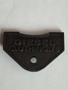 a piece of metal with the words diesel cutting 7 on it's back side