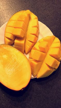 sliced pieces of mango on a white plate