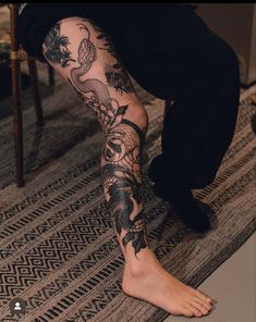 a man with a tattoo on his leg