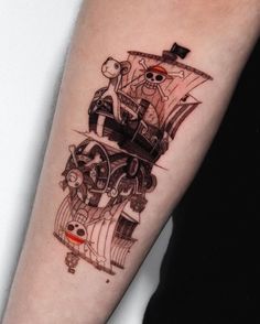 a person with a tattoo on their arm that has an image of a pirate ship