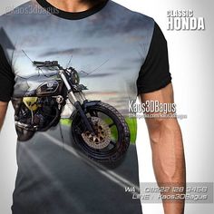 a man wearing a t - shirt with a motorcycle on it