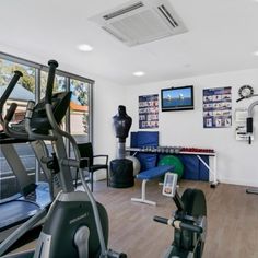 there is a gym with exercise equipment in the room