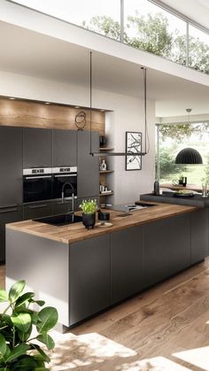 an image of a modern kitchen with wood flooring