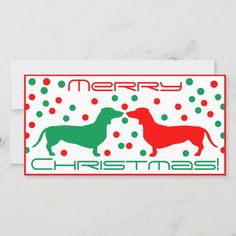 a christmas card with two dachshunds in red, green and white dots