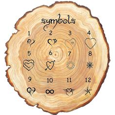 a clock made out of wood with numbers and symbols on the face, as well as hearts