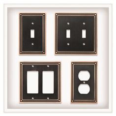 four black and white switch plates in a frame