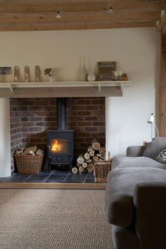 a living room filled with furniture and a fire place