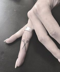 a woman's hand with tattoos on it and the words beautiful finger tattoo for women