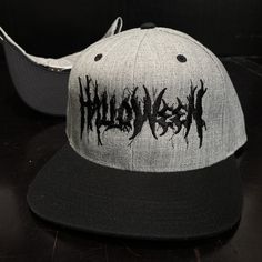 Halloween Metal Grey Hat / Black Bill Snapback Hat 80% Acrylic / 20% Wool BLACK Under-Bill Black Adjustable Fit Flat Bill Snapback Hat, Black Flat Bill Hat For Fan Merchandise, Functional Black Flat Bill Snapback Hat, Black Flat Bill Snapback Hat For Fans, Novelty Black Flat Bill Baseball Cap, Flat Bill Hats, Grey Hat, Snapback Hats, Gothic Fashion