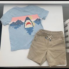 Gap Kids Summer Outfit T-Shirt With Shark Design And Khaki Drawstring Shorts. In Gently Pre-Owned Condition. I Purchased Both Items Brand New And They Were Worn By One Child. Playful Cotton T-shirt By Gap, Playful Gap Top For Playwear, Playful Gap Tops For Playwear, Playful Summer Tops From Gap, Playful Gap Tops For Summer, Playful Summer Tops By Gap, Casual Gap Tops For Playwear, Playful Gap Summer Tops, Playful Gap Short Sleeve T-shirt