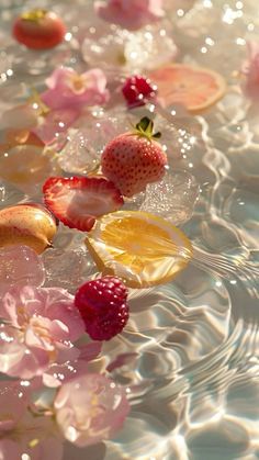 strawberries and other fruit floating in water