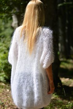 "We created this sweater for the cool summer evenings or your walks on the beach. The sweater is airy,chick and soft. Material is natural fiber mohair and comes in many different colours and shades.If you need a different colour,please contact us to discuss options and prepare a new listing for you at no additional charge. Oversized and One-size sweater fitting from S to XL. Measurements Length from shoulder measured laid flat76cm / 30\" Length from shoulder measured hanging81cm / 32\" Width fro White Mohair Crew Neck Sweater, White Mohair Sweater With Crew Neck, White Short Sleeve Knit Cardigan, White Short Sleeve Sweater For Fall, White Knitted Short Sleeve Sweater, Casual Mohair Crew Neck Top, White Short Sleeve Knitted Sweater, White Short Sleeve Summer Sweater, White Short Sleeve Sweater For Summer