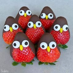 chocolate covered strawberries with googly eyes and fake strawberries in the shape of owls