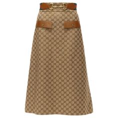 GUCCI Aria GG monogram crystal brown leather horsebit A-line midi skirt IT38 XS Reference: AAWC/A00499 Brand: Gucci Designer: Alessandro Michele Collection: Aria 2022 - Runway Material: Fabric, Leather Color: Brown, Yellow Pattern: Monogram Closure: Zip Lining: Brown Fabric Extra Details: Zip back. Pockets at the front are decorative. Made in: Italy CONDITION: Condition: Very good, this item was pre-owned and is in very good condition. Please refer to image gallery for thorough condition check. Micro dents on leather surface. Distressed buckle effect due to original design. Comes with: Style code present (Generic) SIZING Designer size: IT38 Size reference: US0 / UK6 / IT38 / FR34 / XXS-XS MEASUREMENTS: Waist: 33cm / 12.9" Hip: 43cm / 16.8" Length: 79cm / 30.8" This Gucci item is authentic. Luxury Beige Gucci Bottoms, Luxury Fitted Brown Skirt, Luxury Leather Skirt, Yellow Runway, Gucci Aria, Gucci Skirt, Zip Lining, Burgundy Skirt, Gucci Designer