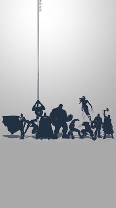 silhouettes of people standing in front of a flag pole