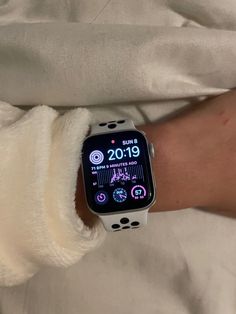 an apple watch on someone's arm showing the time