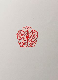 an image of a red flower on white paper