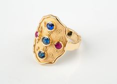 🎁 FREE Worldwide Shipping with DHL & FedEx EXPRESS Assured, fast delivery. ✈ ║║Solid Gold Byzantine Design Wide Ring - Goldsmith Jewelry Workshop║║ ON SALE 15% OFF 🎁 UNIQUE JEWELRY DISCOUNT ► Solid Gold 18K. ► Sapphire and ruby natural stones. ✪ Natural Sapphire: 0.62ct (all together) ✪ Natural Ruby: 0.16ct (both together) ❚ Dimensions: 2.2 x 1.5cm at top ❚ Bottom band: 0.4cm width WE CREATE FULL CUSTOM MADE , HIGH END JEWELRY LEAVE US YOUR MESSAGE TO DISCUSS YOUR IDEAL PIECE ☼ Thank you! Gold Multi-stone Oval Cabochon Ring, Gold Multi-stone Oval Sapphire Ring, Gold Multi-stone Sapphire Ring With Oval Shape, Gold Oval Sapphire Ring With Multi-stones, 14k Gold Rings With Stones, Oval Yellow Gold Rings With Stones, Gold Oval Multi-stone Birthstone Ring, Byzantine Oval Gemstone Jewelry, Byzantine Style Oval Gemstone Jewelry